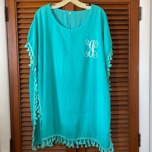 Aqua one size fits all coverup with letter “J”.
